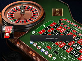 Et roulettebord og hjul hvor spilleren lige har vundet på rød 16