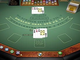 Et blackjackbord hvor spilleren lige har vundet, da dealeren gik bust med en værdi på 22